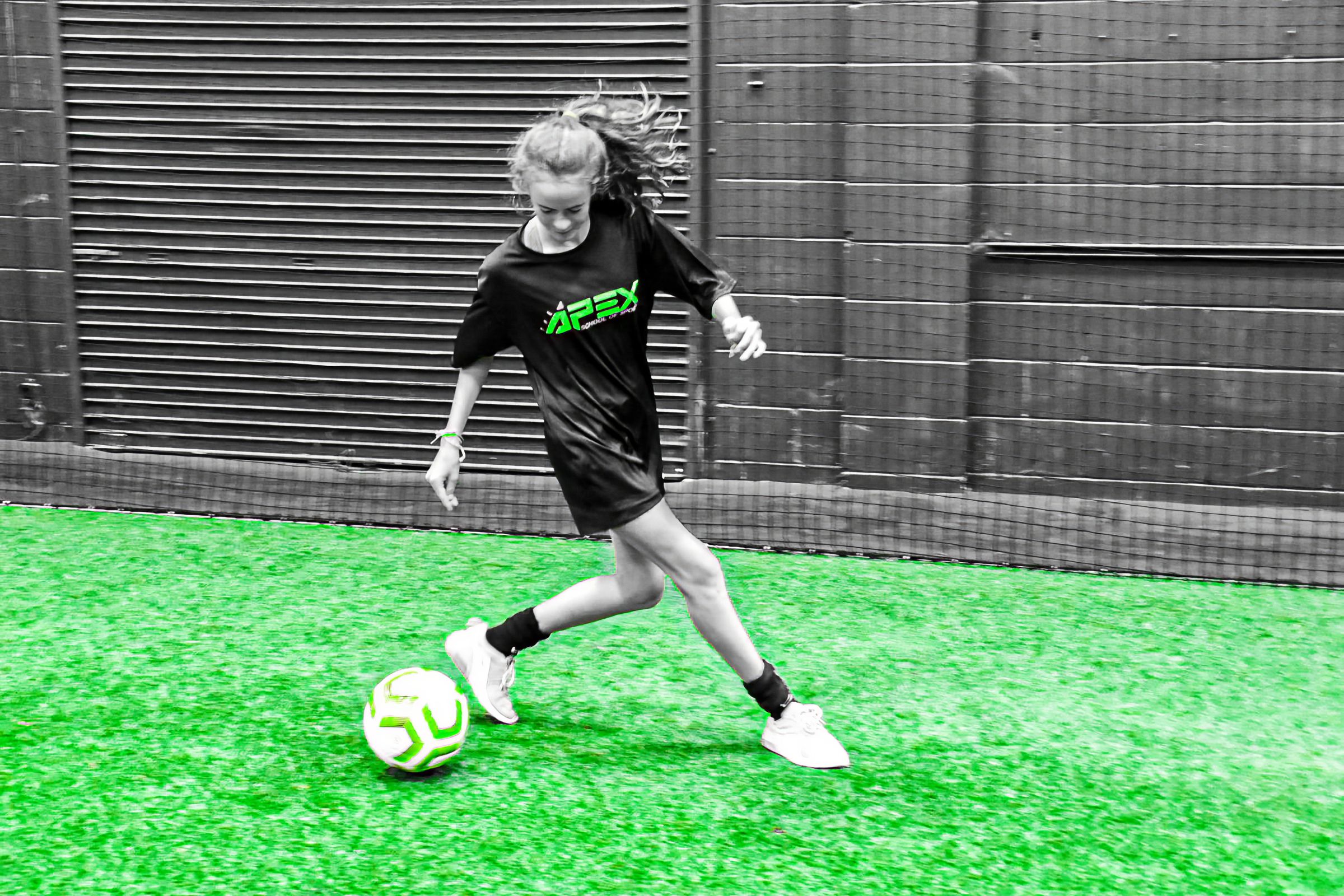 APEX player striking the ball