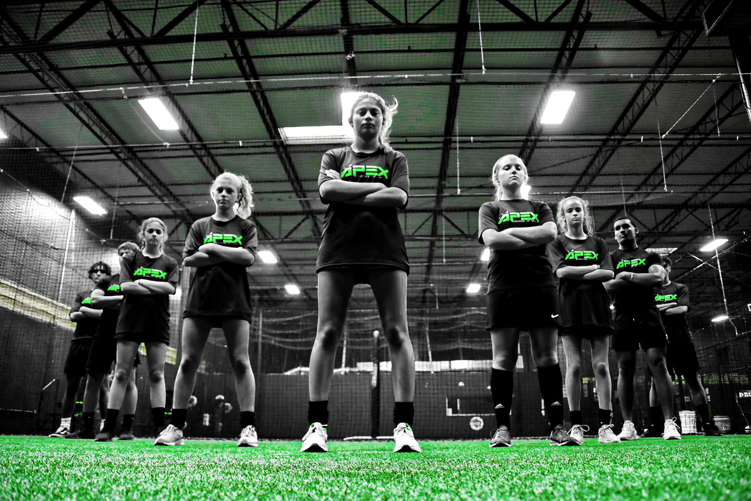 APEX athletes standing together on the turf