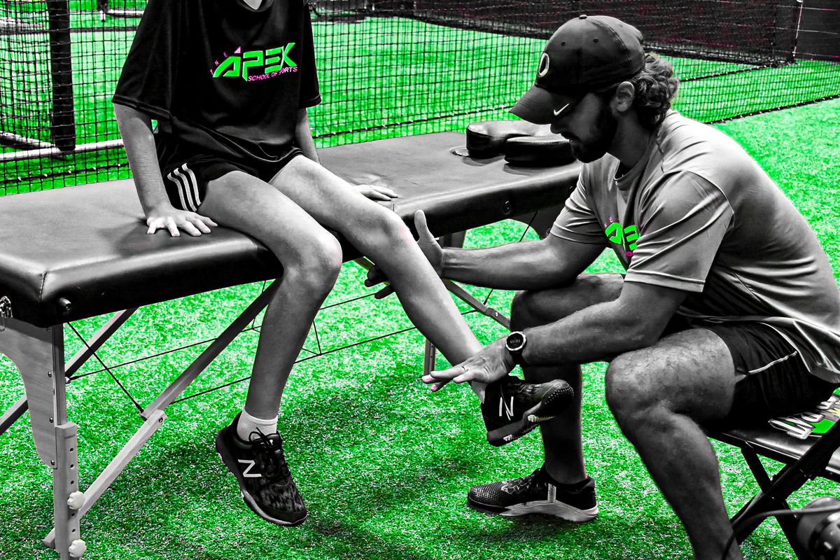 Trainer working with an APEX athlete