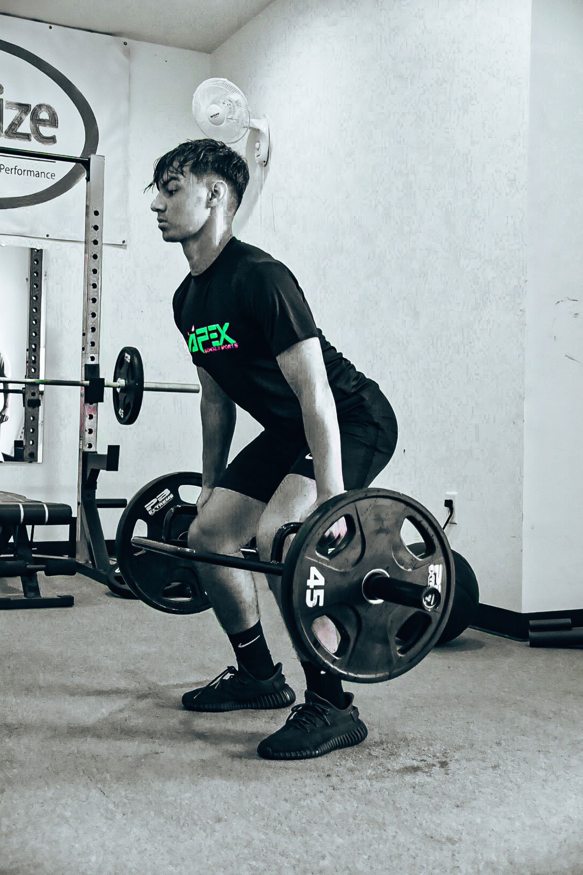 APEX athlete lifting in the weight room